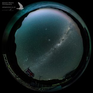 Round image of the Bird Island night sky